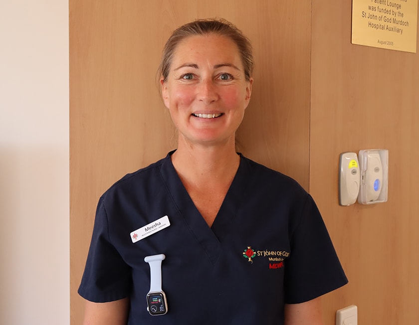 Image of scholarship winner Meesha Astill standing in front of hospital corridor