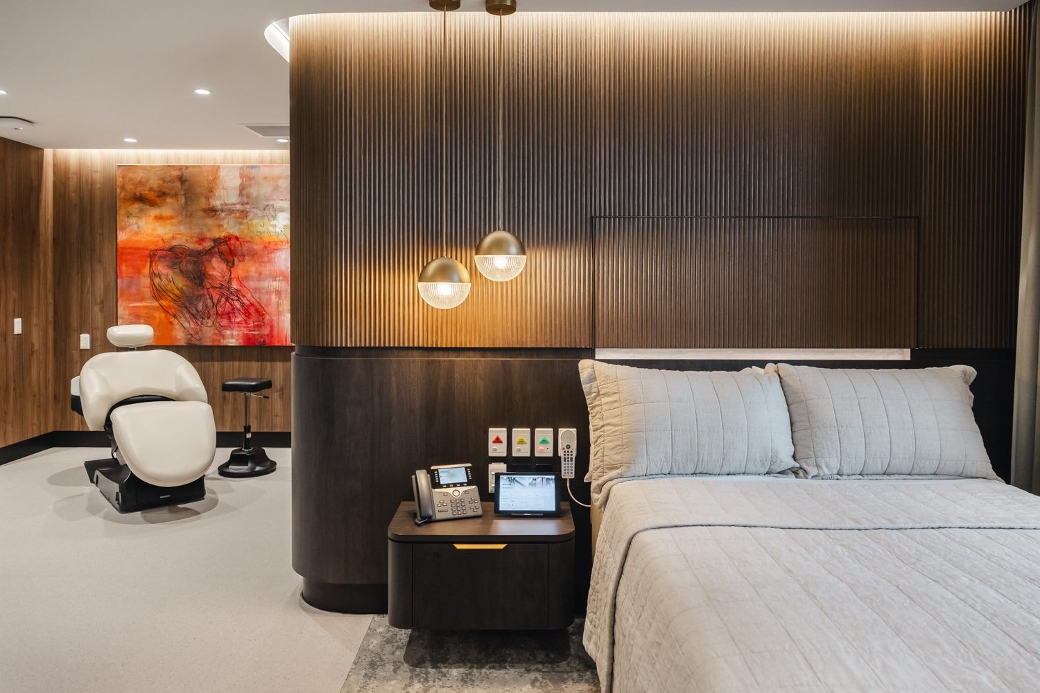 The bed and massage chair in The Suites