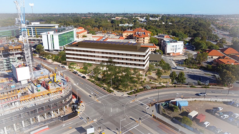 An aerial view of the proposed Orthonova building, showing a render of the building on an intersection of two main roads.