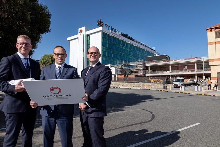 St John of God Murdoch Hospital CEO Ben Irish, St John of God Health Care CEO Bryan Pyne and St John of God Health Care COO Ben Edwards standing outside St John of God Murdoch Hospital.
