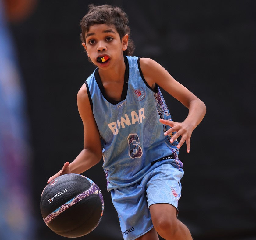 Young boy playing basketball